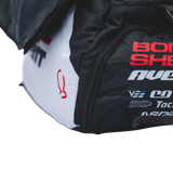 Bombshell Training Kit Bag in black with white side panel, red logo text, square form, visible zip, bold athletic branding.