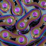 Gusset Oil Slick MX Chain 1/8" with oil-slick finish, aluminium links, purple bolts, rainbow tones. Ideal for BMX racing. 