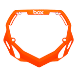 Box Two BMX Number Plates by SSS Racing, bright orange frame with cutout vents, silver hardware, bold white logo, tested