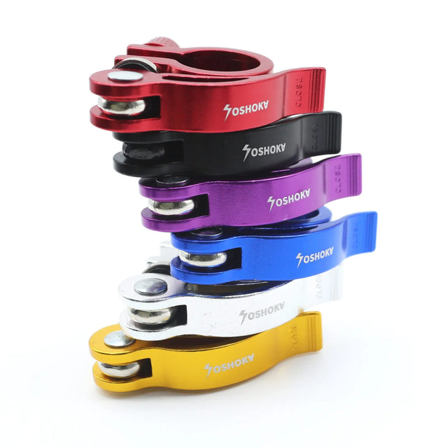 Set of colourful bike handlebar clamps with 'Yoshoka' branding on a white background