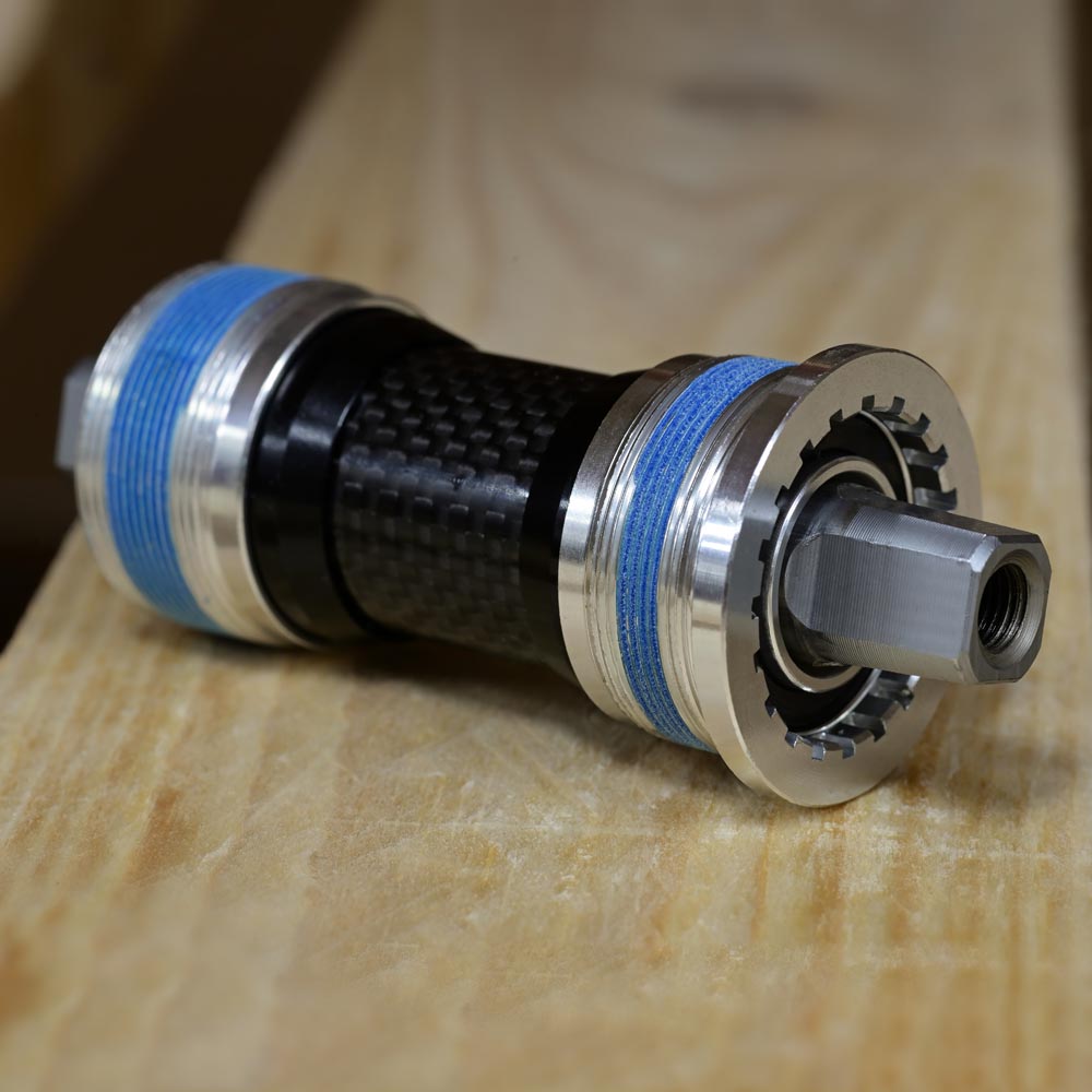 Karyotype JIS Square Taper Bottom Bracket by SSS Racing carbon shell, anodized silver, precision machined aluminum spindle.